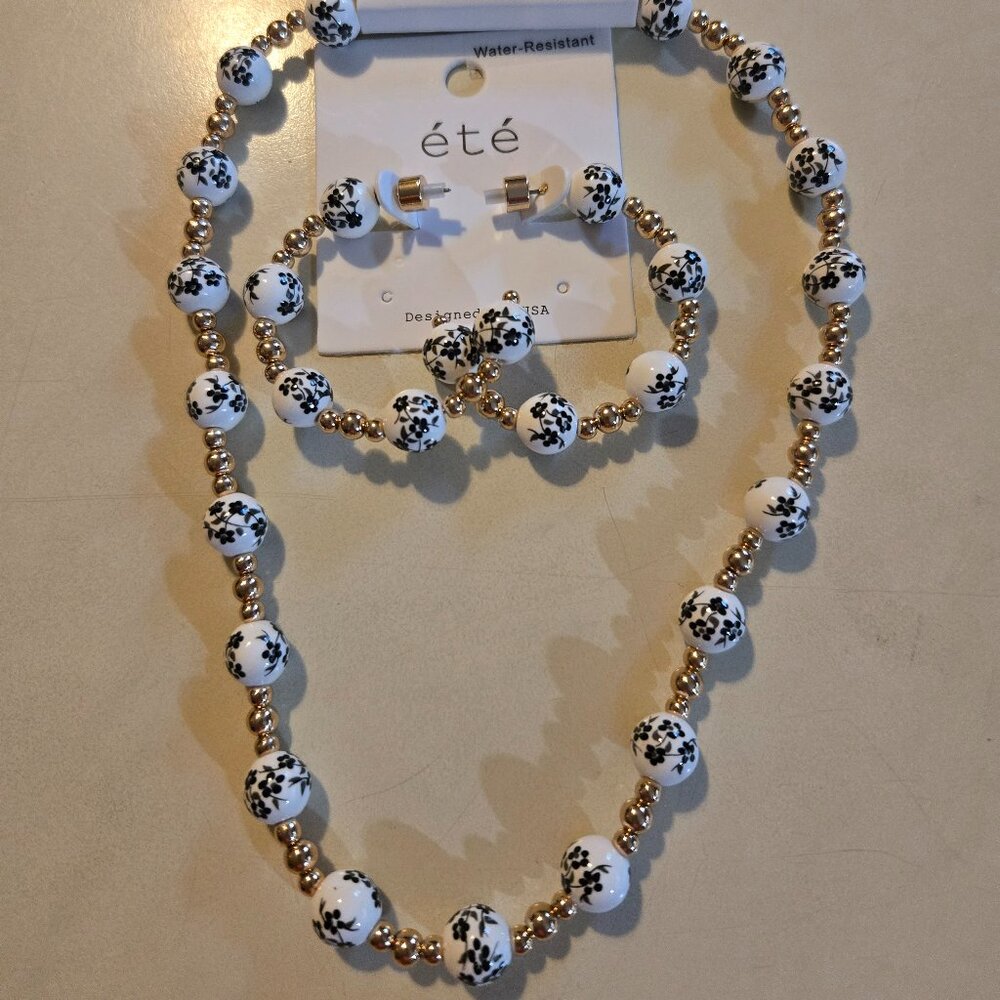 ETE black/white floral bead necklace with matching hoops. NWT